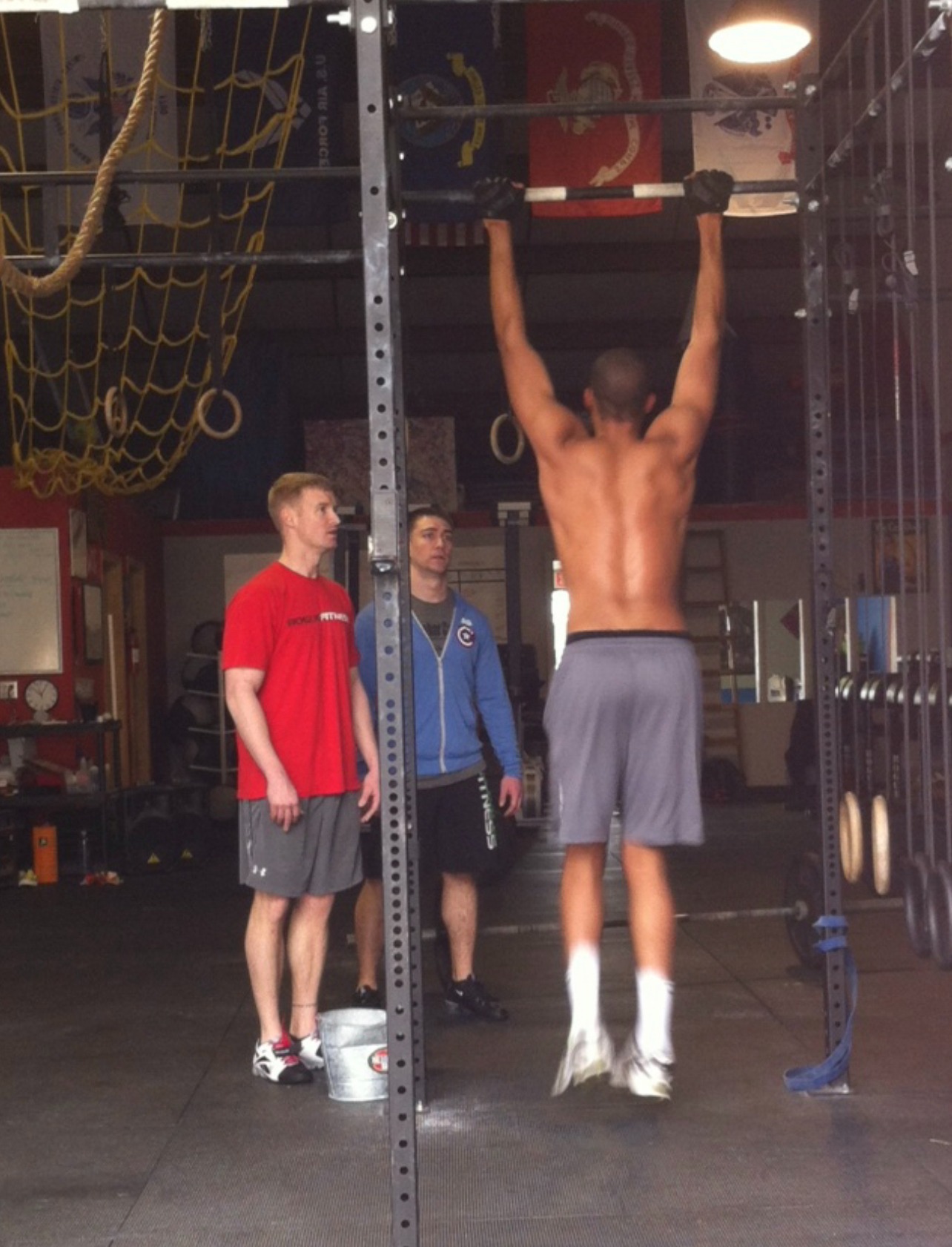 Freddie doing pull-ups in a gym